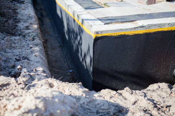 Professional Waterproofing technician working in Lakeland, NY